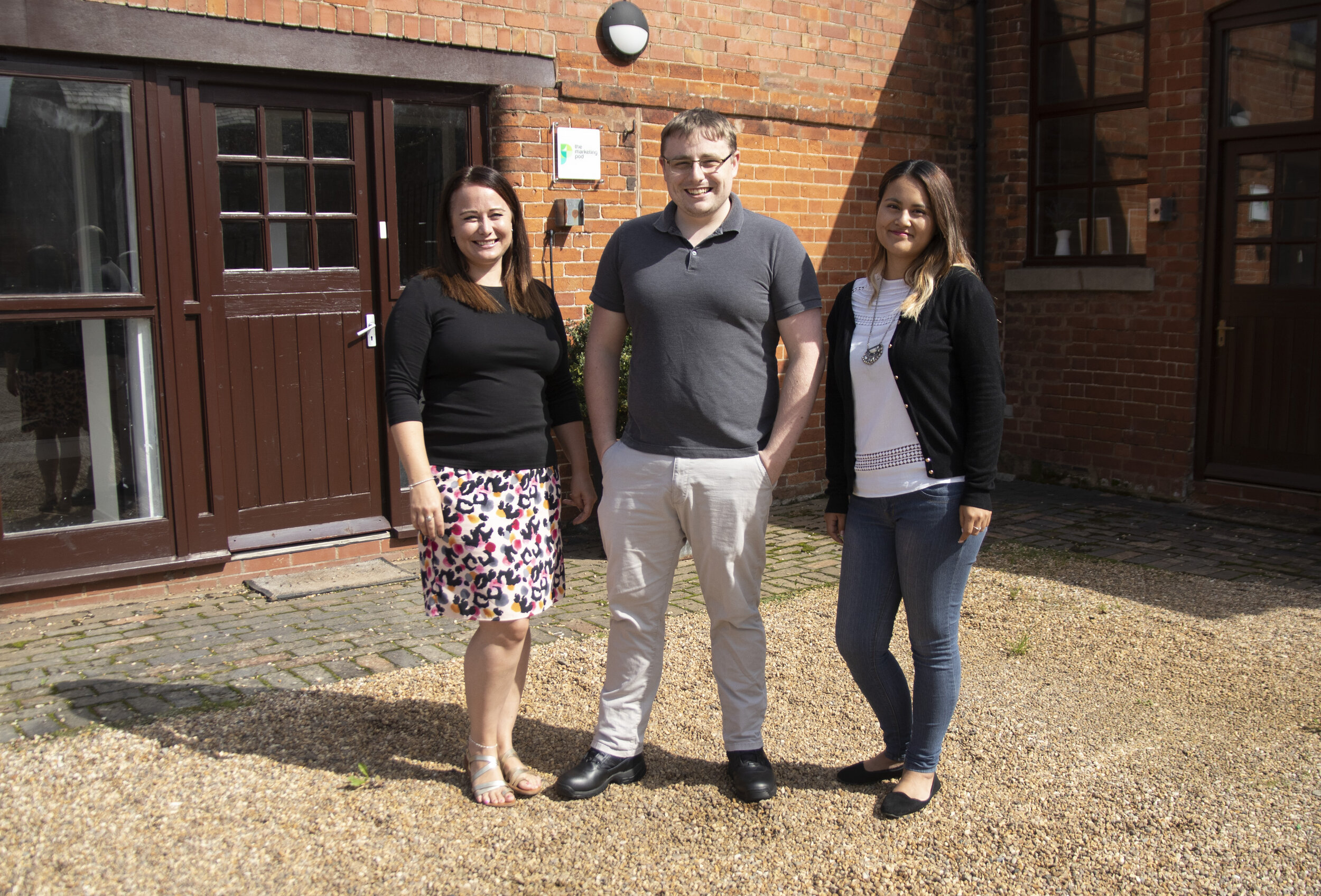 Group photo of the three newest members of the Marketing Pod.