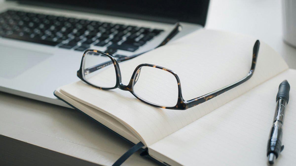 Glasses resting on a book.